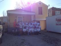 The team in front of the house we helped weatherize, and paint.